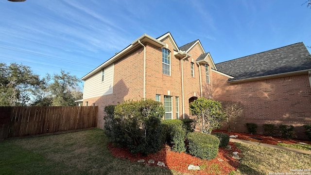 view of property exterior with a yard