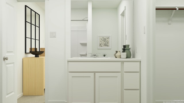 bathroom with walk in shower and vanity