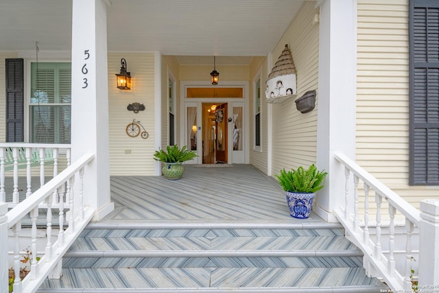 doorway to property featuring covered porch