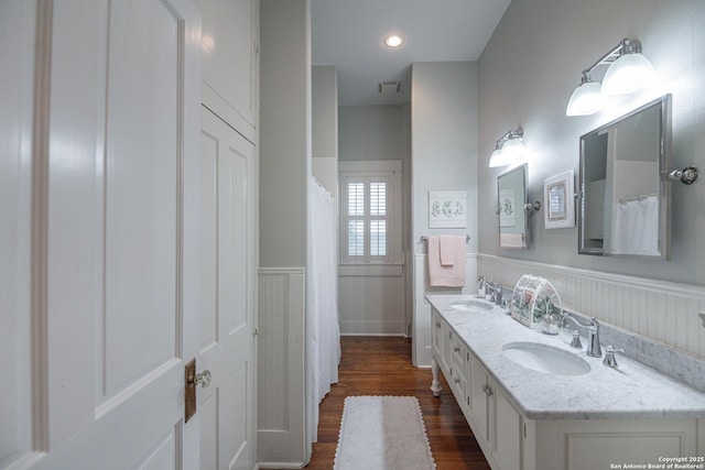 bathroom with vanity and hardwood / wood-style floors