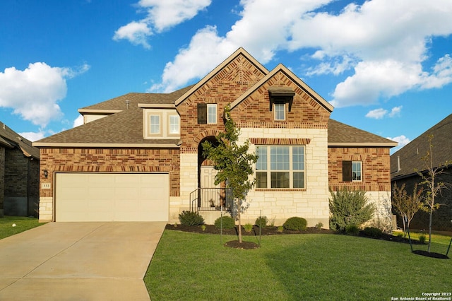 view of front facade with a garage and a front yard