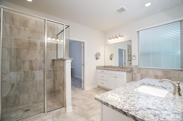 bathroom featuring vanity and walk in shower