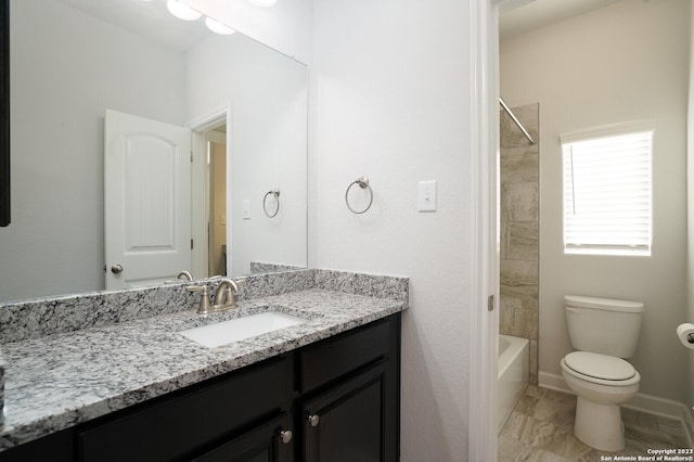 full bathroom with tiled shower / bath combo, vanity, and toilet