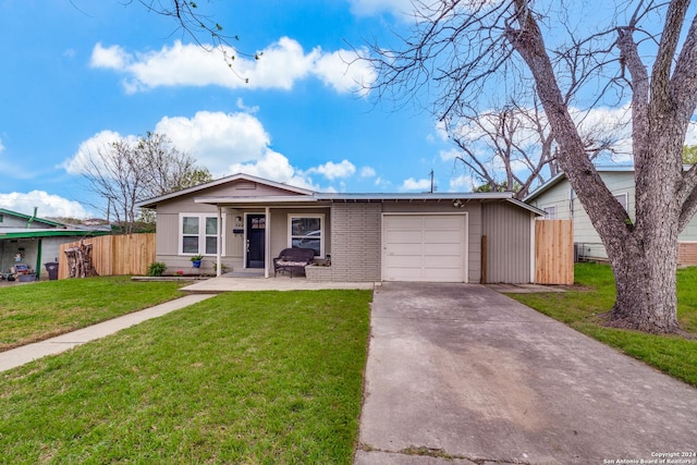 view of front of property with a garage and a front lawn