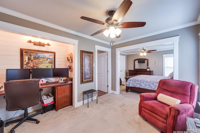 carpeted bedroom with crown molding and ceiling fan