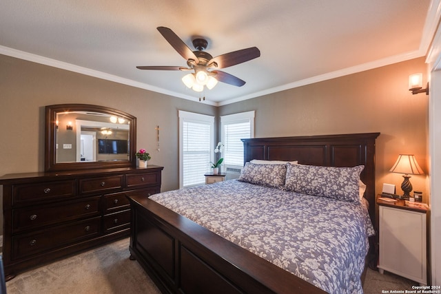 carpeted bedroom featuring ceiling fan and ornamental molding