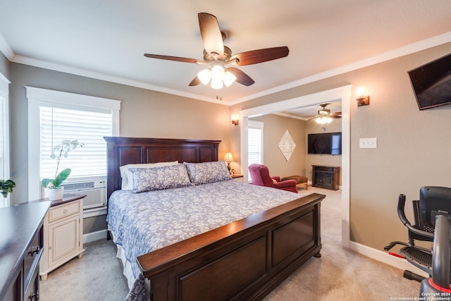 bedroom featuring cooling unit, light colored carpet, ornamental molding, and ceiling fan