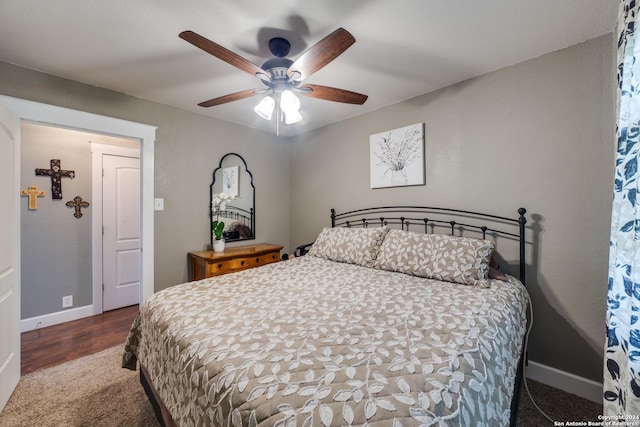 bedroom with wood-type flooring and ceiling fan