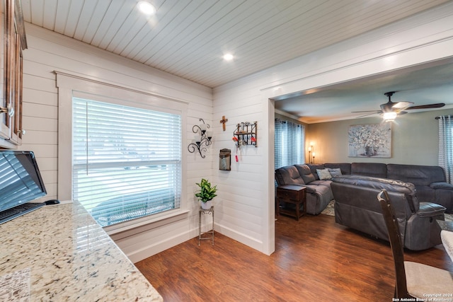 interior space featuring crown molding, dark hardwood / wood-style floors, and ceiling fan