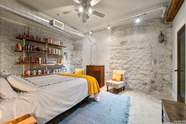 bedroom featuring concrete floors