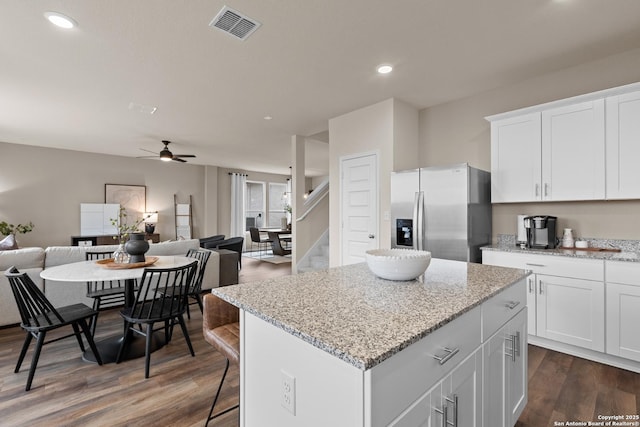 kitchen featuring white cabinetry, stainless steel refrigerator with ice dispenser, dark hardwood / wood-style floors, and ceiling fan