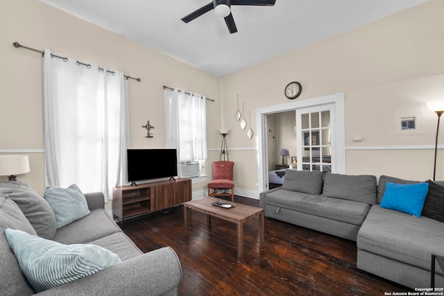 living room featuring dark wood-type flooring, ceiling fan, and cooling unit