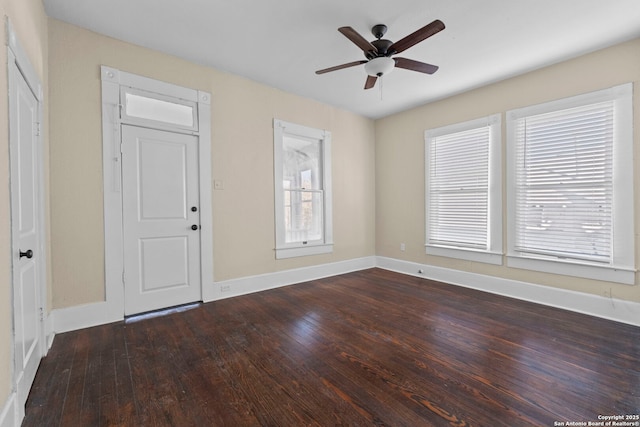 interior space with ceiling fan and dark hardwood / wood-style floors