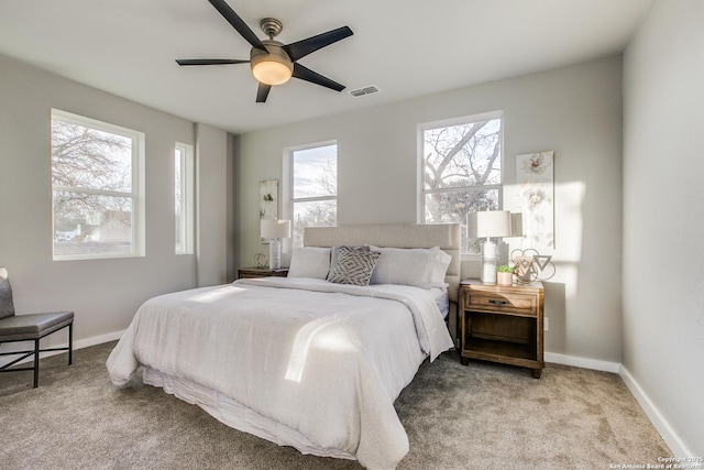 bedroom featuring ceiling fan and light colored carpet