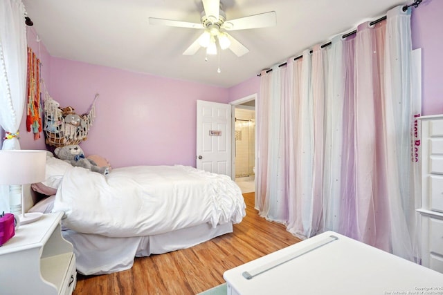 bedroom with ceiling fan and hardwood / wood-style floors