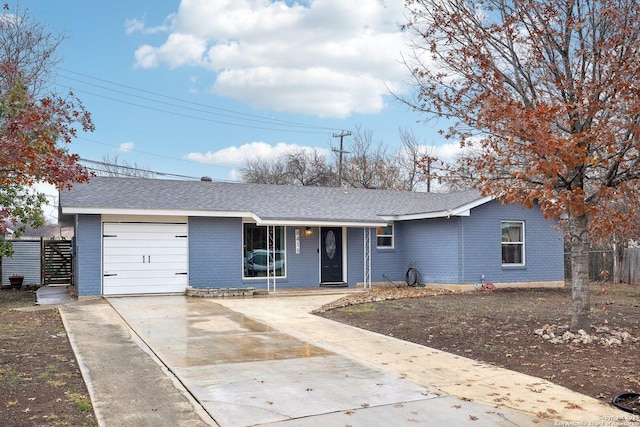 ranch-style house featuring a garage