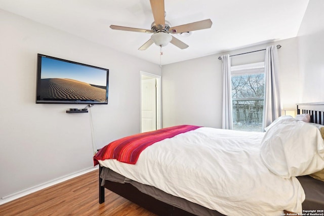 bedroom featuring ceiling fan and wood-type flooring