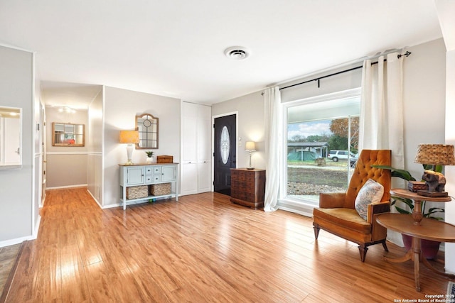 sitting room featuring light hardwood / wood-style floors