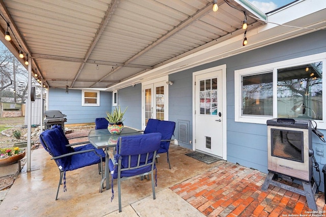 view of patio / terrace with heating unit and grilling area