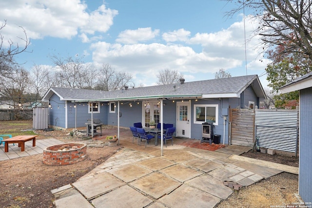 back of house featuring a patio area and an outdoor fire pit