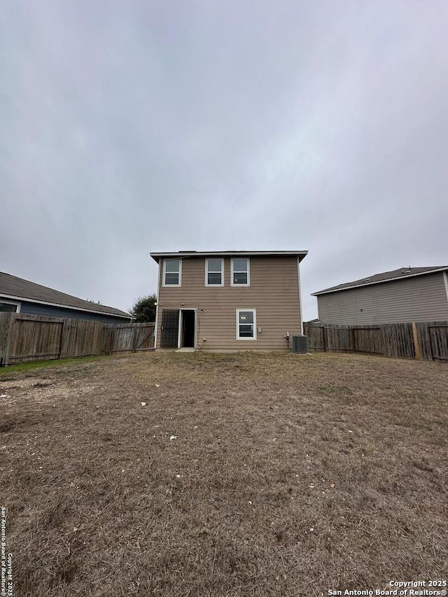 back of property featuring central AC unit