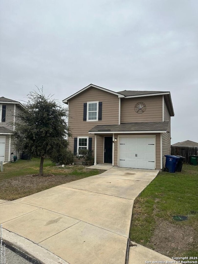 front facade featuring a garage and a front lawn