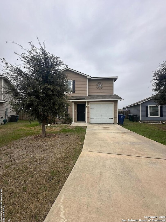 view of front of home with a garage and a front yard