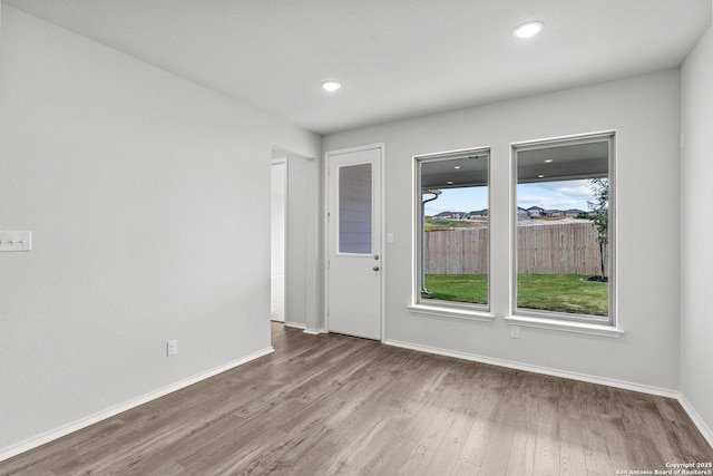 2439 Tinkerton, San Antonio, TX 78245 - spare room with wood finished floors, baseboards, and recessed lighting
