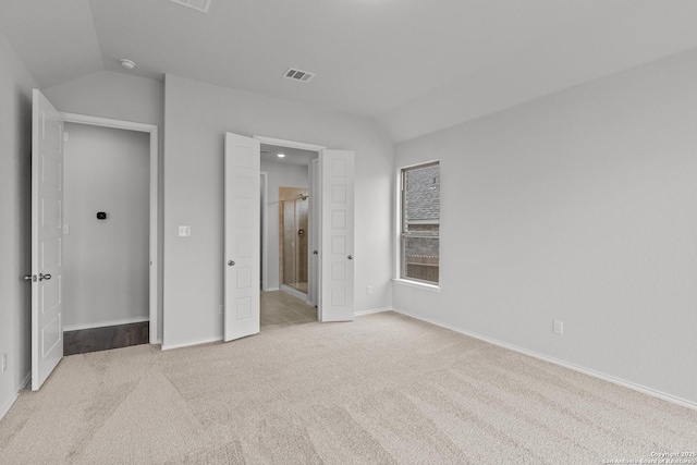 2439 Tinkerton, San Antonio, TX 78245 - unfurnished bedroom featuring vaulted ceiling, carpet floors, baseboards, and connected bathroom