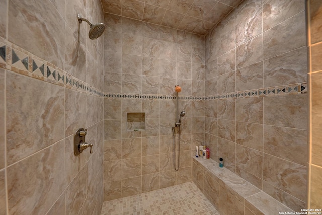 bathroom with tiled shower