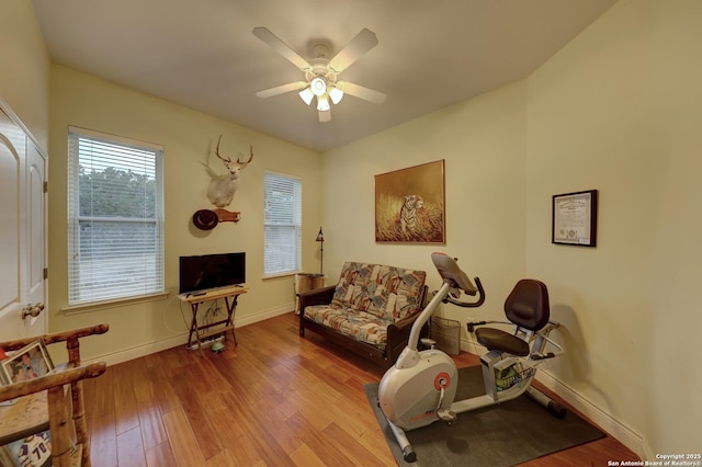 sitting room featuring ceiling fan and light hardwood / wood-style floors