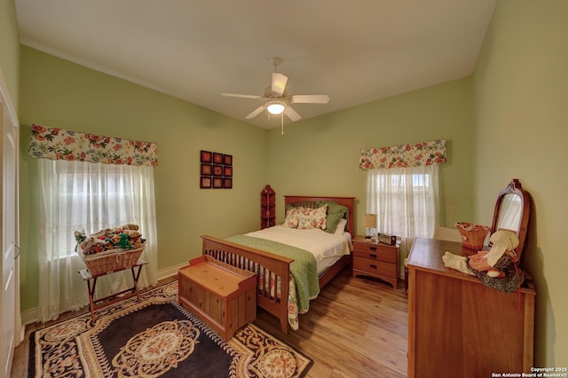 bedroom featuring ceiling fan and light wood-type flooring