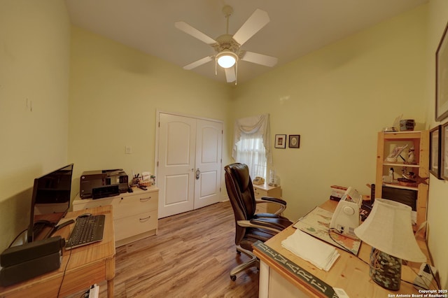 home office featuring ceiling fan and light hardwood / wood-style flooring