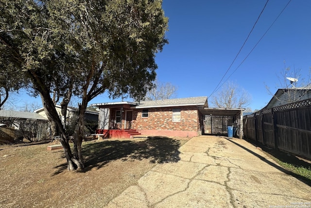 rear view of property featuring a carport