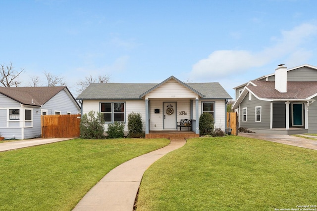 view of front facade with a front yard and a porch