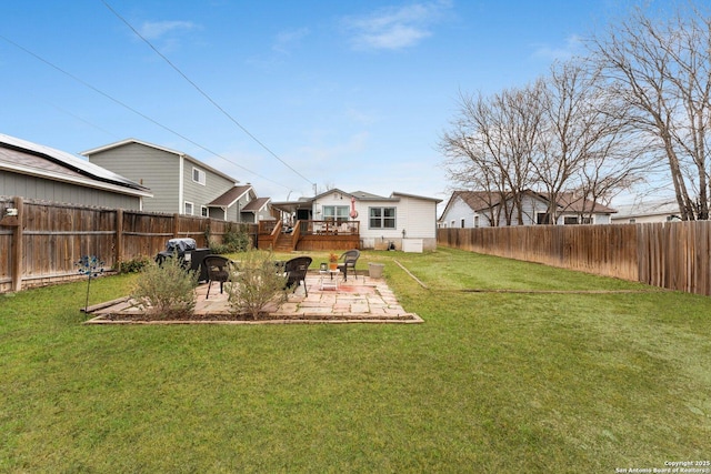 view of yard with a patio area and a deck