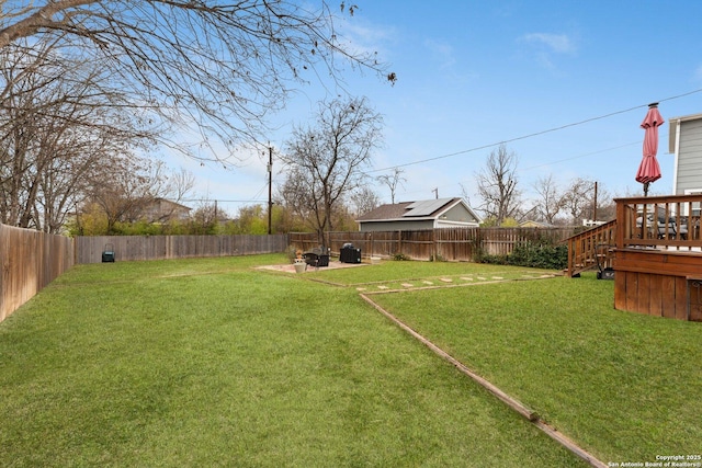 view of yard with a deck and a patio area