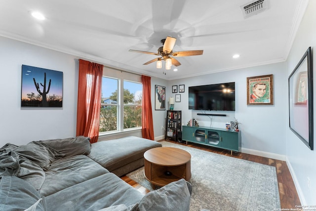 living room with crown molding, hardwood / wood-style flooring, and ceiling fan