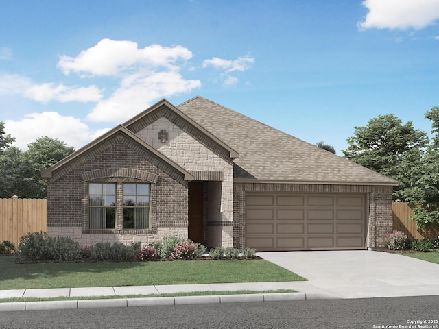 view of front of home featuring a garage and a front yard