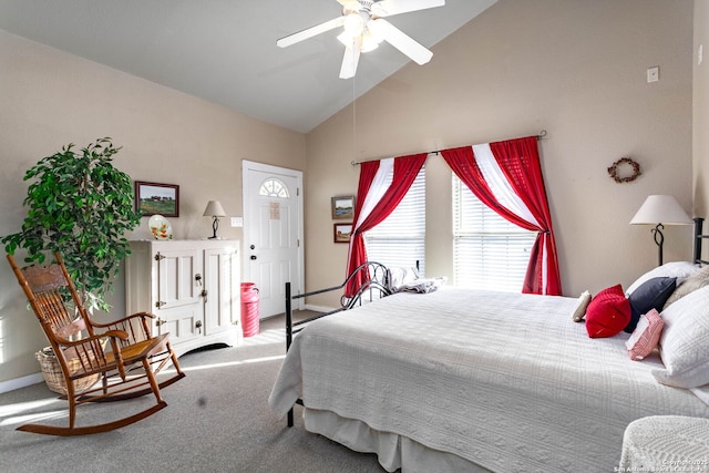 carpeted bedroom with high vaulted ceiling