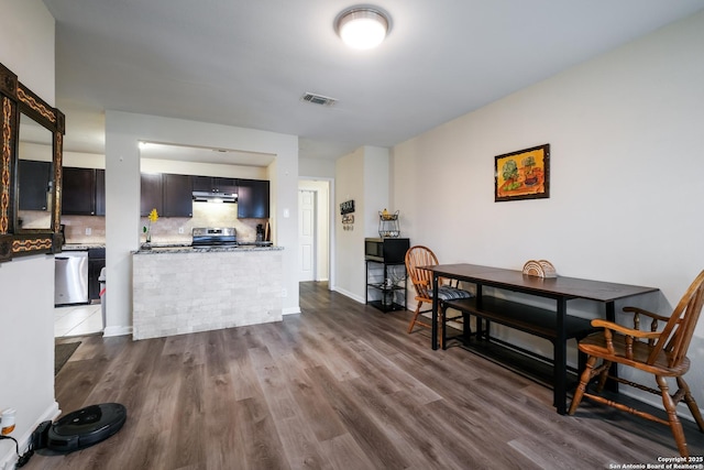 dining space with dark hardwood / wood-style floors