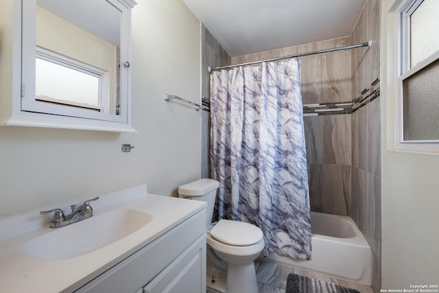 full bathroom with shower / bath combination with curtain, vanity, and toilet