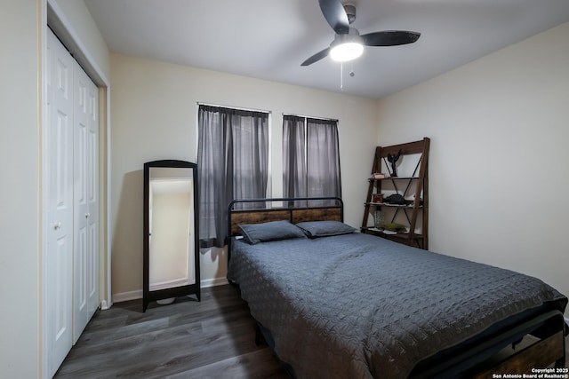 bedroom featuring ceiling fan, dark hardwood / wood-style flooring, and a closet