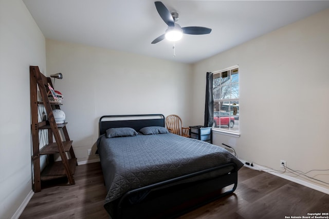 bedroom featuring dark wood-type flooring and ceiling fan