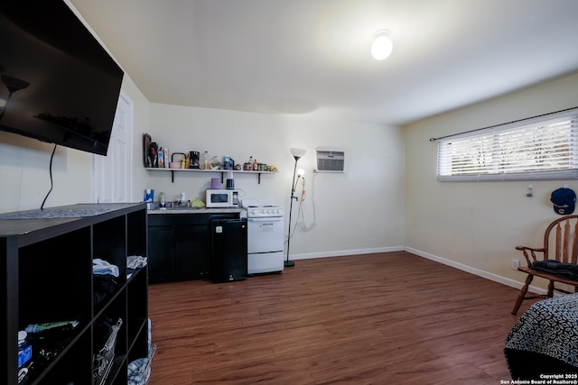 bar featuring dark hardwood / wood-style flooring, a wall mounted air conditioner, and white appliances