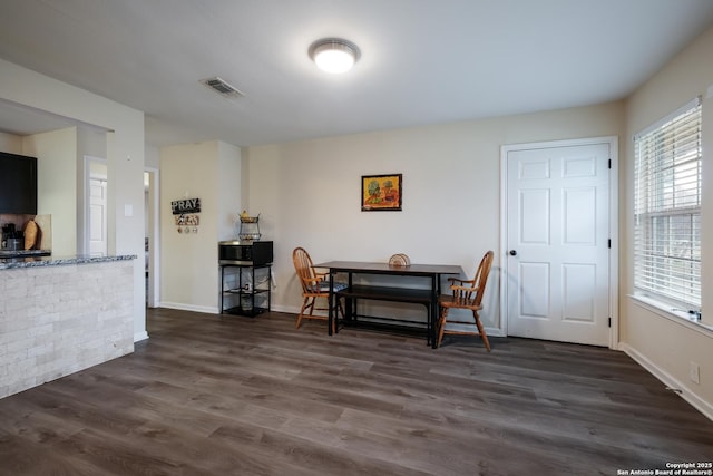 dining room featuring dark hardwood / wood-style flooring