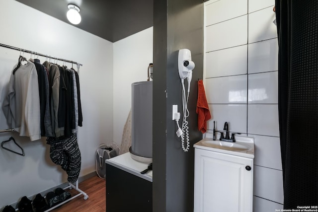 bathroom with vanity and wood-type flooring