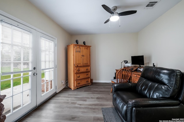 living area featuring ceiling fan and light wood-type flooring