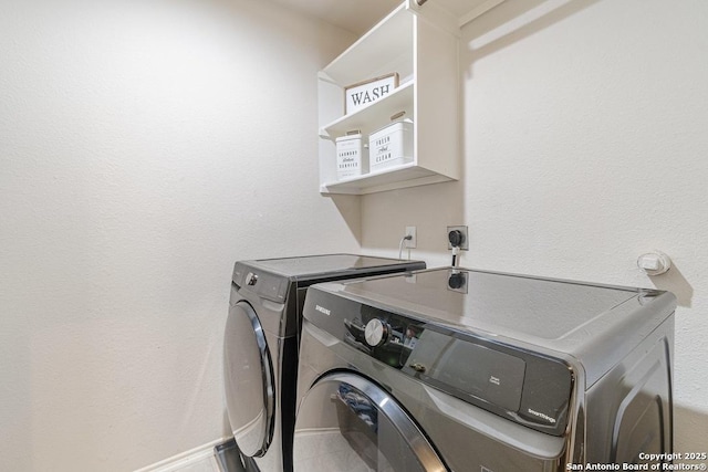 laundry room with washer and dryer