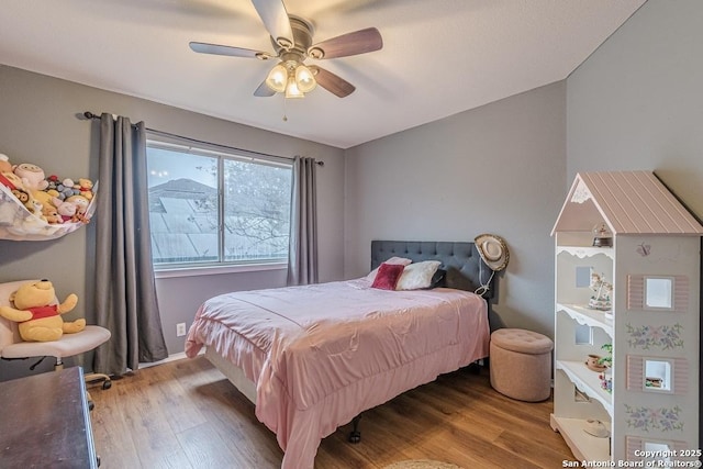 bedroom featuring ceiling fan and light wood-type flooring